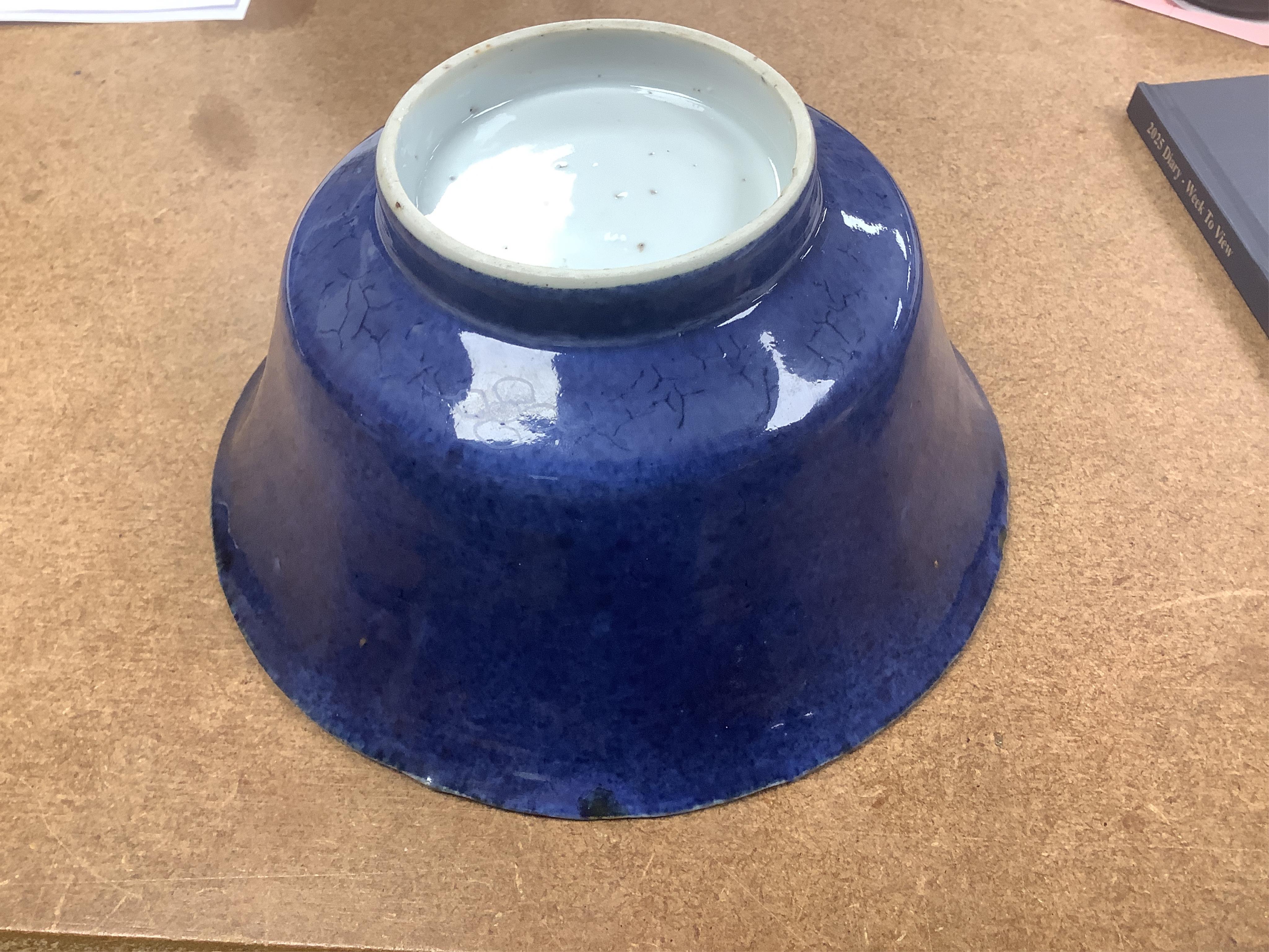 A Chinese powder blue bowl, early 18th century and a Chinese blue and white prunus jar - tallest 13cm. Condition - fair